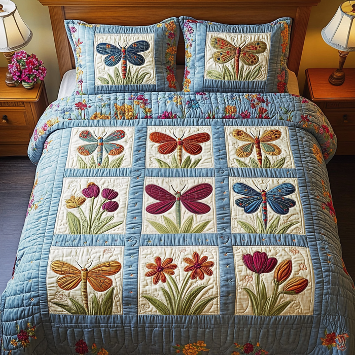 Magical Wings Dragonfly quilted 3-piece bedding set on a made bed with two matching pillow shams