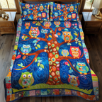 Adorable Owls quilted 3-piece bedding set on a made bed with two matching pillow shams