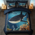 Aqua Voyager Ocean quilted 3-piece bedding set on a made bed with two matching pillow shams