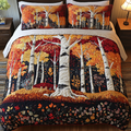 Autumn Forest quilted 3-piece bedding set on a made bed with two matching pillow shams