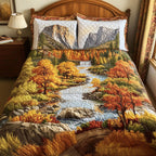 Autumn In Yosemite quilted 3-piece bedding set on a made bed with two matching pillow shams