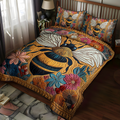 Bee Bliss quilted 3-piece bedding set on a made bed with two matching pillow shams