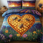 Bee Dance quilted 3-piece bedding set on a made bed with two matching pillow shams