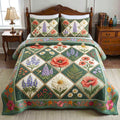 Bloom Patchwork quilted 3-piece bedding set on a made bed with two matching pillow shams