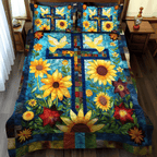 Blossoming Faith quilted 3-piece bedding set on a made bed with two matching pillow shams