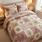 Blush Garden Cottage quilted 3-piece bedding set on a made bed with two matching pillow shams