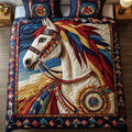 Brave Spirit quilted 3-piece bedding set on a made bed with two matching pillow shams