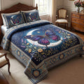 Butterfly Bloom quilted 3-piece bedding set on a made bed with two matching pillow shams