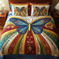 Butterfly Charm quilted 3-piece bedding set on a made bed with two matching pillow shams