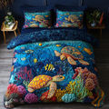 Coastal Glide quilted 3-piece bedding set on a made bed with two matching pillow shams