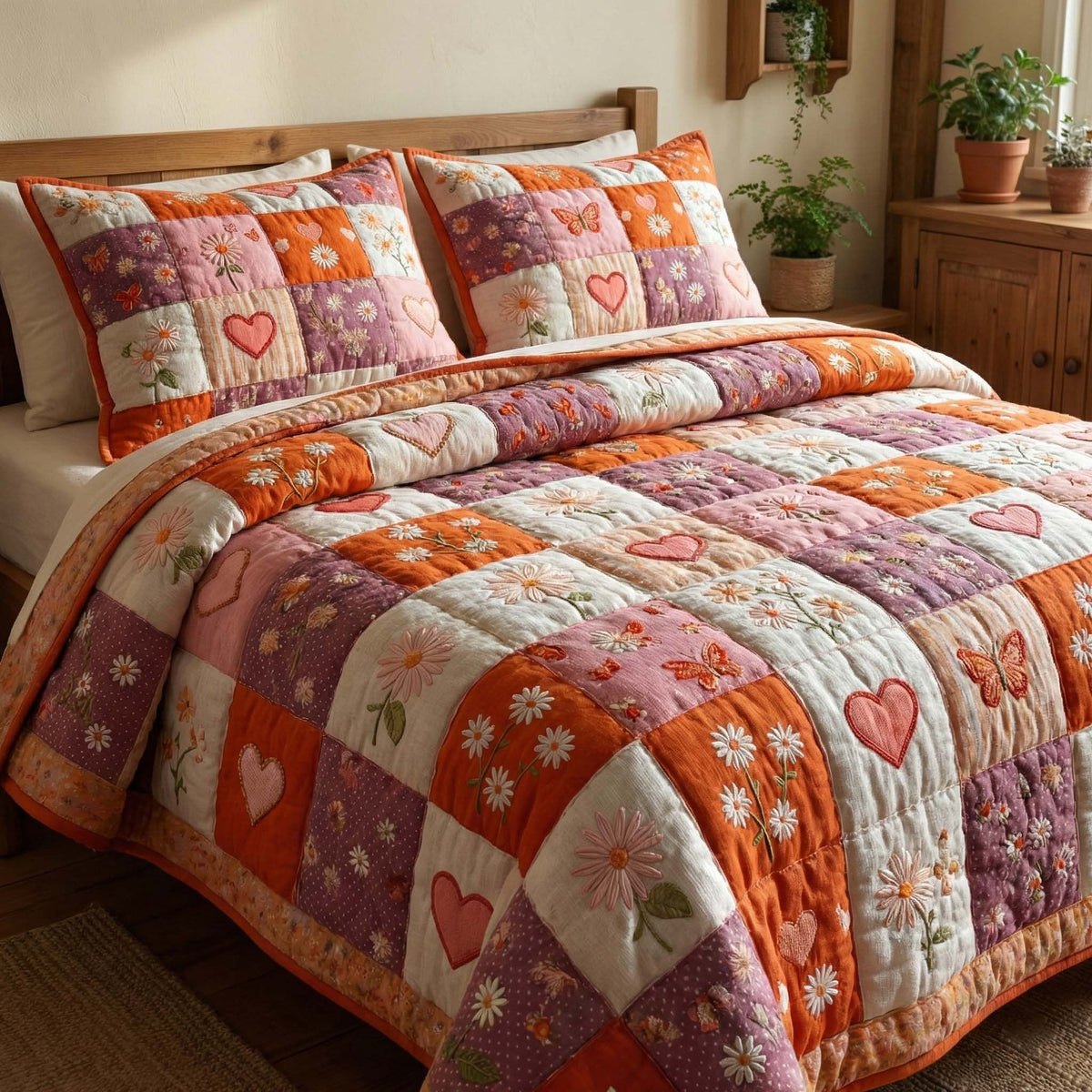 Coral Meadow quilted 3-piece bedding set on a made bed with two matching pillow shams