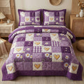 Daisy Hearts quilted 3-piece bedding set on a made bed with two matching pillow shams
