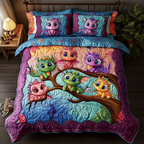 Dragon Lair quilted 3-piece bedding set on a made bed with two matching pillow shams