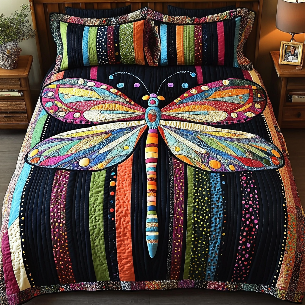 Dragonfly Dreams Bedspread quilted 3-piece bedding set on a made bed with two matching pillow shams
