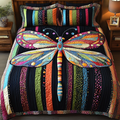 Dragonfly Dreams Bedspread quilted 3-piece bedding set on a made bed with two matching pillow shams