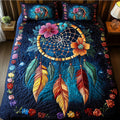 Dream Weaver quilted 3-piece bedding set on a made bed with two matching pillow shams