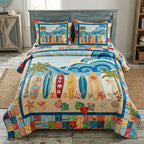 Endless Summer Surf quilted 3-piece bedding set on a made bed with two matching pillow shams