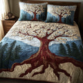 Eternal Branch Tree Of Life quilted 3-piece bedding set on a made bed with two matching pillow shams