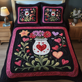 Everlasting Love quilted 3-piece bedding set on a made bed with two matching pillow shams