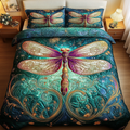 Garden Glider Dragonfly quilted 3-piece bedding set on a made bed with two matching pillow shams