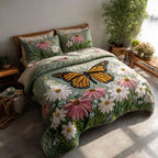 Garden Glow Cat quilted 3-piece bedding set on a made bed with two matching pillow shams