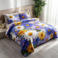 Garden Glow Daisy quilted 3-piece bedding set on a made bed with two matching pillow shams