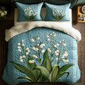 Gentle Bells quilted 3-piece bedding set on a made bed with two matching pillow shams