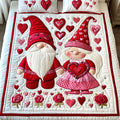 Gnome Heartstrings quilted 3-piece bedding set on a made bed with two matching pillow shams