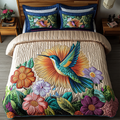 Golden Glow Hummingbird quilted 3-piece bedding set on a made bed with two matching pillow shams