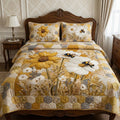 Golden Meadow Bloom quilted 3-piece bedding set on a made bed with two matching pillow shams
