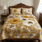Golden Meadow Bloom quilted 3-piece bedding set on a made bed with two matching pillow shams