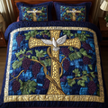 Grapevine Cross Blue quilted 3-piece bedding set on a made bed with two matching pillow shams
