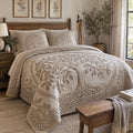 Ivory Tree Of Life quilted 3-piece bedding set on a made bed with two matching pillow shams
