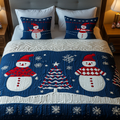 Jolly Snowman Holiday quilted 3-piece bedding set on a made bed with two matching pillow shams