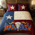 Lone Star Spirit Blue Bonnets quilted 3-piece bedding set on a made bed with two matching pillow shams