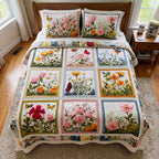 Meadow Blossom Retreat quilted 3-piece bedding set on a made bed with two matching pillow shams