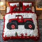Merry Monster Truck quilted 3-piece bedding set on a made bed with two matching pillow shams