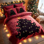 Midnight Whiskers Christmas quilted 3-piece bedding set on a made bed with two matching pillow shams