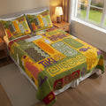 Mystic Tiki Retreat quilted 3-piece bedding set on a made bed with two matching pillow shams