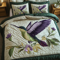 Nature Whirl quilted 3-piece bedding set on a made bed with two matching pillow shams