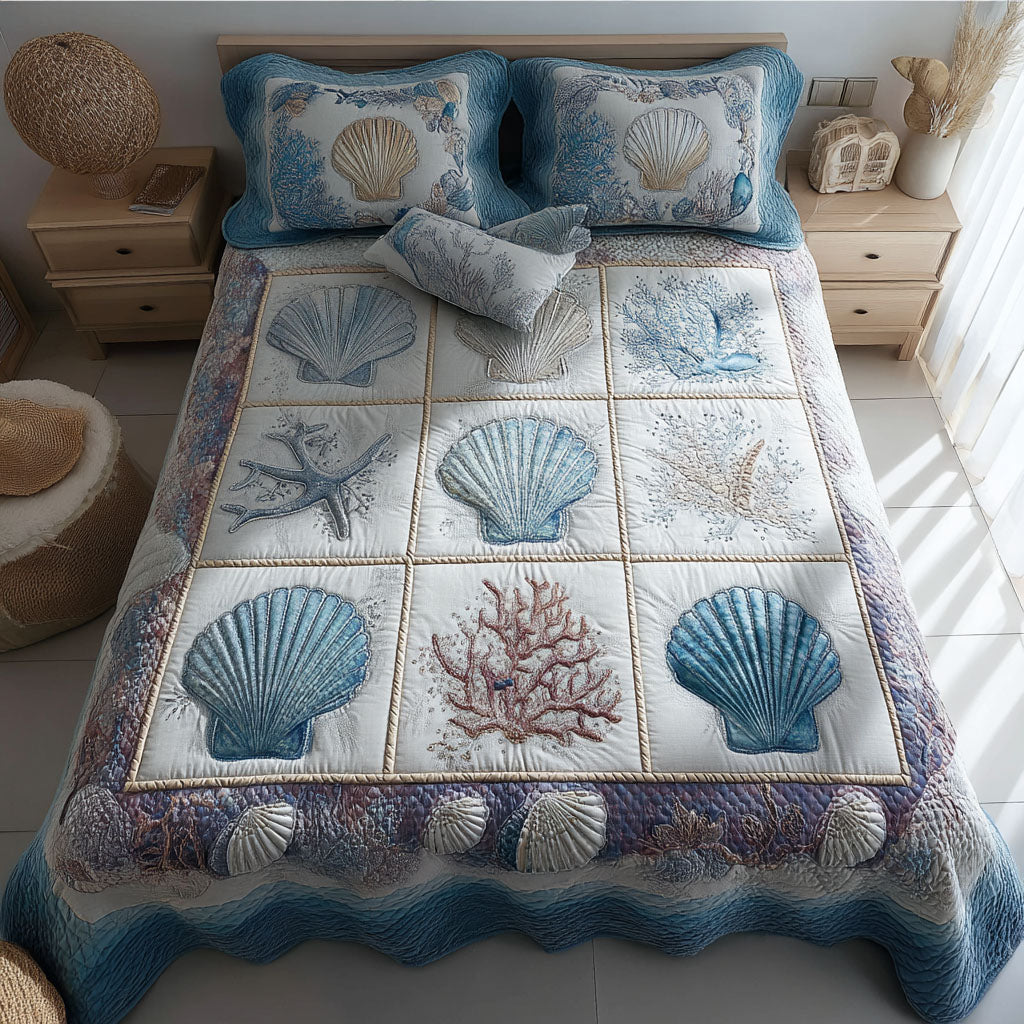 Neutral Coastal Shells quilted 3-piece bedding set on a made bed with two matching pillow shams