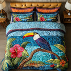 Ocean Breeze Bird quilted 3-piece bedding set on a made bed with two matching pillow shams