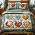 Ocean Hearts quilted 3-piece bedding set on a made bed with two matching pillow shams