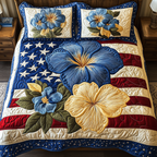 Patch Petals quilted 3-piece bedding set on a made bed with two matching pillow shams