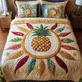 Pineapple quilted 3-piece bedding set on a made bed with two matching pillow shams