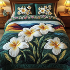 Plumeria Glow Beach quilted 3-piece bedding set on a made bed with two matching pillow shams