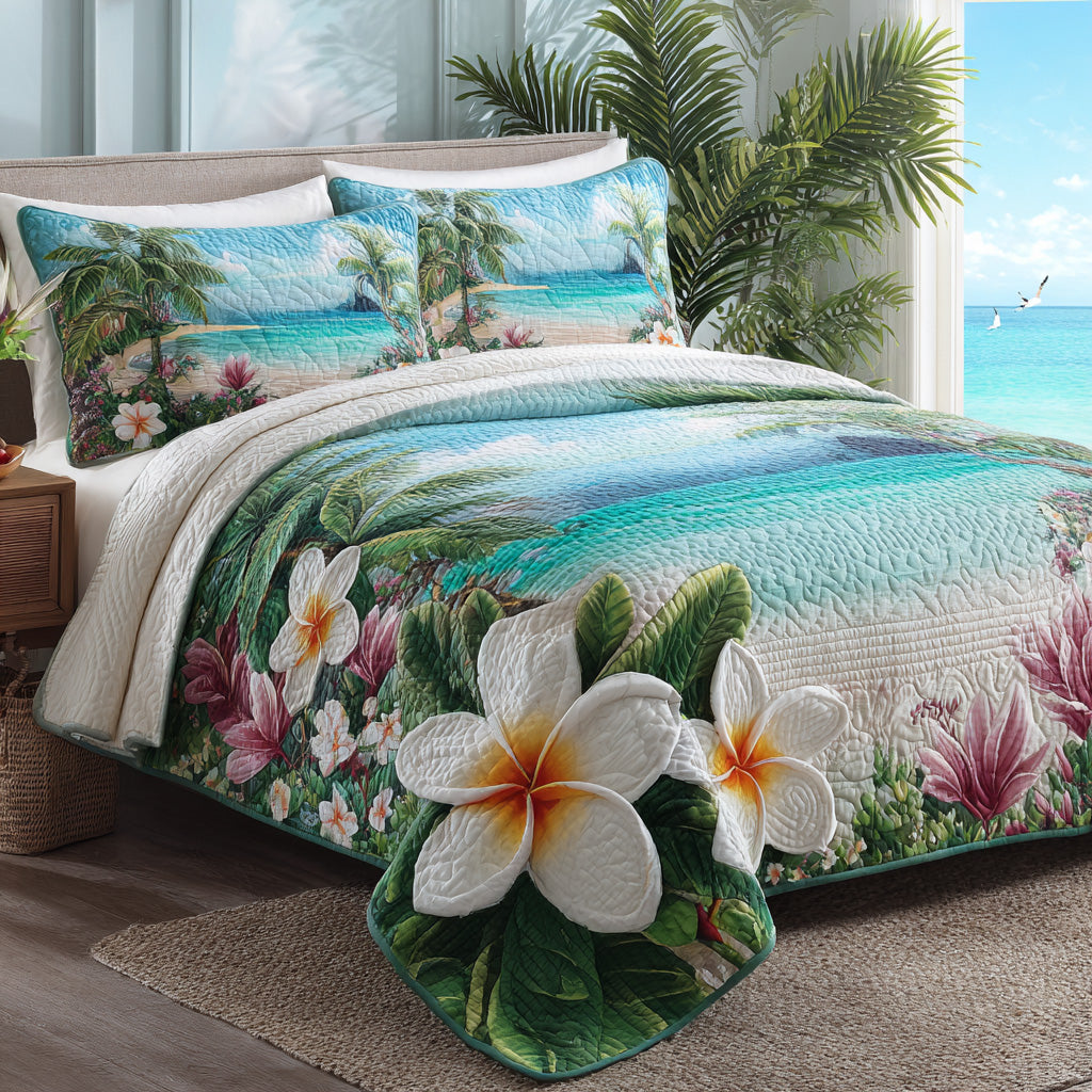 Plumeria Shore quilted 3-piece bedding set on a made bed with two matching pillow shams
