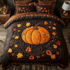 Pumpkin Glow Autumn quilted 3-piece bedding set on a made bed with two matching pillow shams