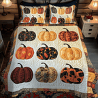 Pumpkin Magic quilted 3-piece bedding set on a made bed with two matching pillow shams