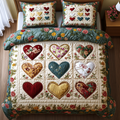Rustic Love Path quilted 3-piece bedding set on a made bed with two matching pillow shams